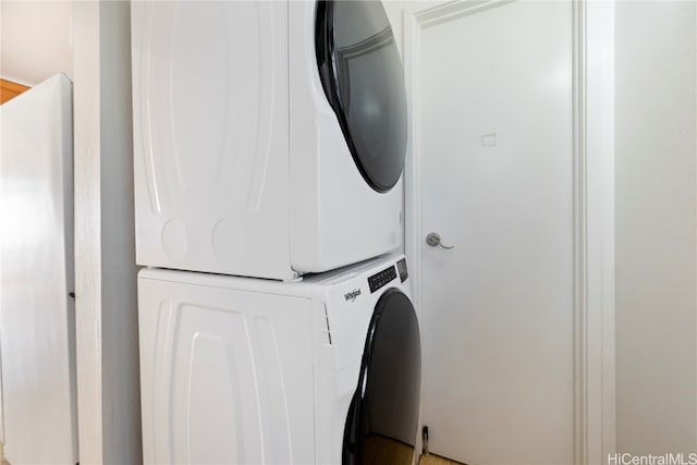 laundry room featuring stacked washer and dryer