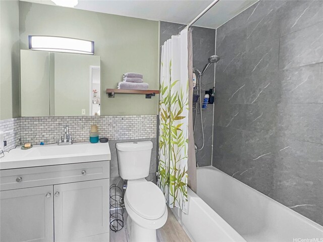 95-510 Wikao St Unit F201, Mililani, HI 96789 - bathroom featuring shower / bath combo, vanity, toilet, tile walls, and wood finished floors