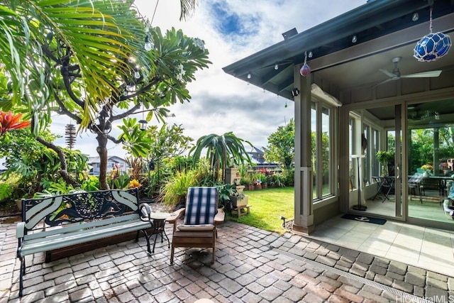 view of patio featuring ceiling fan