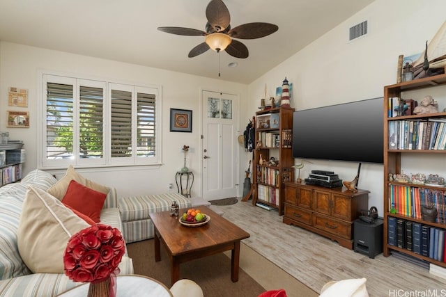 living room with lofted ceiling and ceiling fan