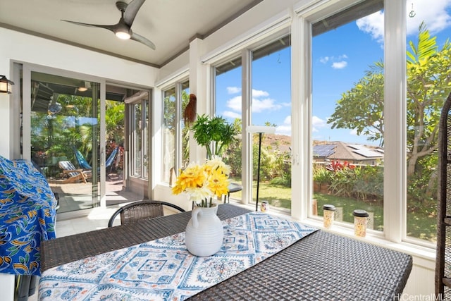 sunroom / solarium with ceiling fan