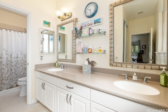 bathroom with walk in shower, vanity, toilet, and tile patterned floors