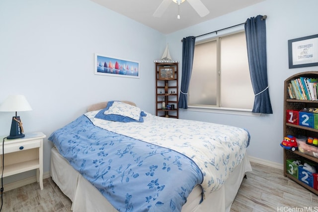 bedroom featuring light hardwood / wood-style floors and ceiling fan