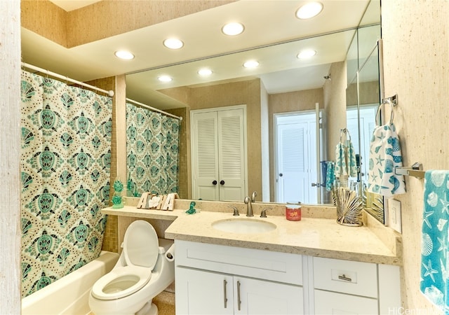 full bathroom featuring vanity, shower / bath combo, and toilet