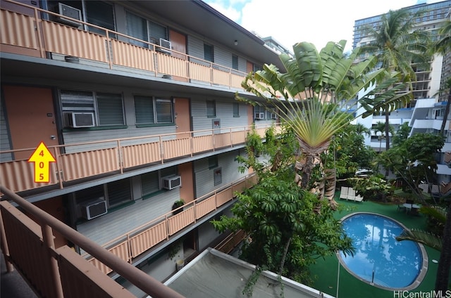 view of property featuring a wall mounted air conditioner