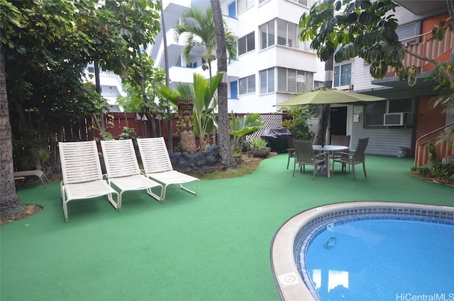 view of pool featuring a patio area and cooling unit