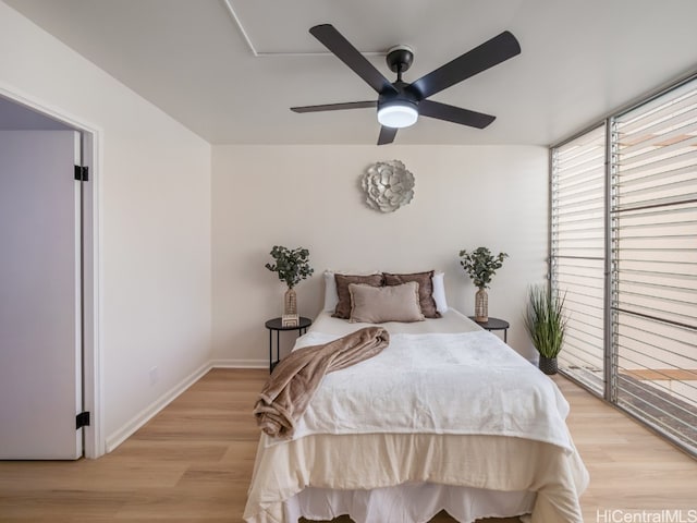 bedroom with light wood-type flooring and ceiling fan