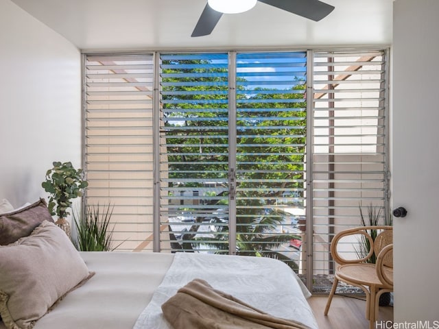 bedroom with hardwood / wood-style flooring and ceiling fan