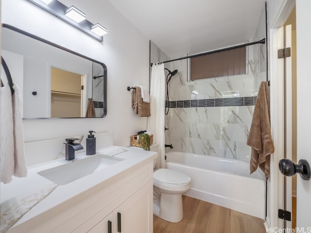 full bathroom with vanity, toilet, shower / tub combo, and hardwood / wood-style floors