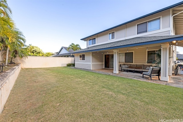 back of property featuring a yard and a patio area