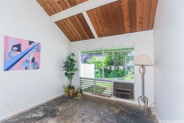 unfurnished living room with lofted ceiling with beams, cooling unit, and concrete flooring