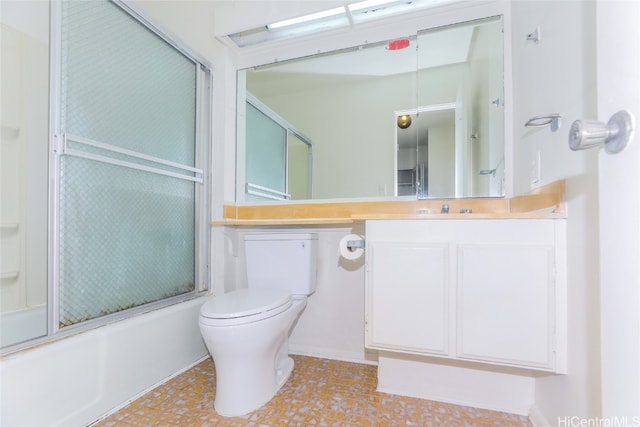 full bathroom with shower / bath combination with glass door, vanity, and toilet