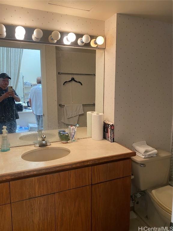 bathroom featuring vanity and toilet