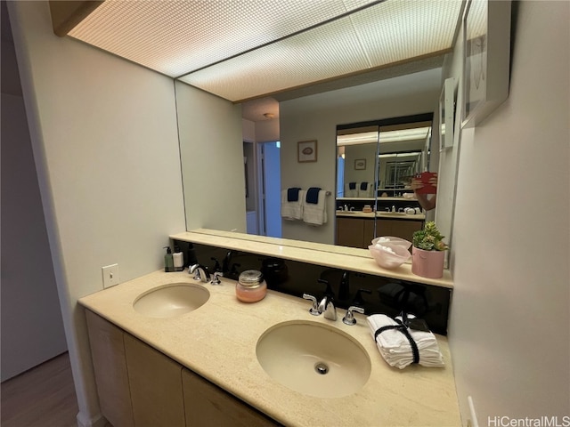 bathroom featuring vanity and hardwood / wood-style flooring