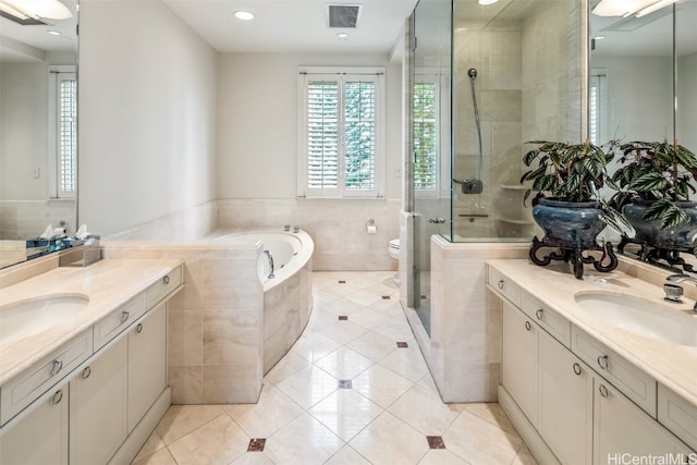 full bathroom with vanity, toilet, independent shower and bath, and tile patterned flooring