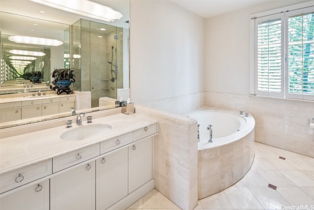 bathroom featuring vanity, shower with separate bathtub, and tile patterned floors