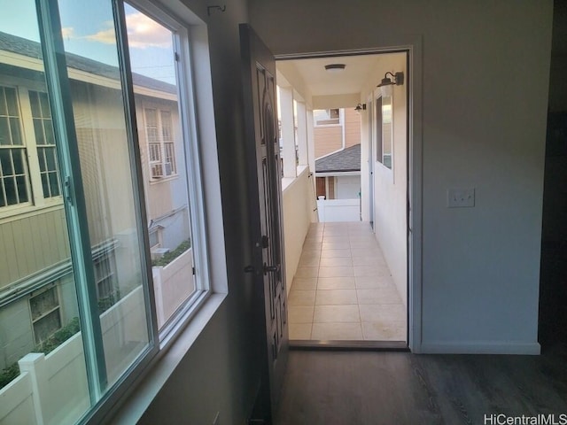 corridor with hardwood / wood-style floors