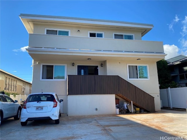 view of front of home featuring a balcony