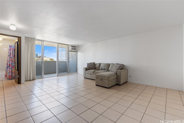 tiled living room featuring expansive windows