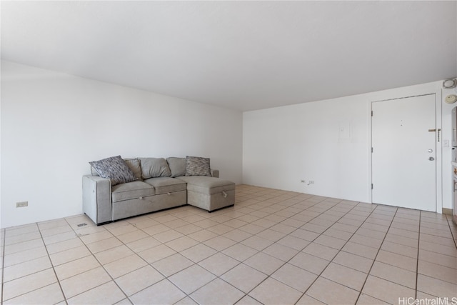 unfurnished living room with light tile patterned floors