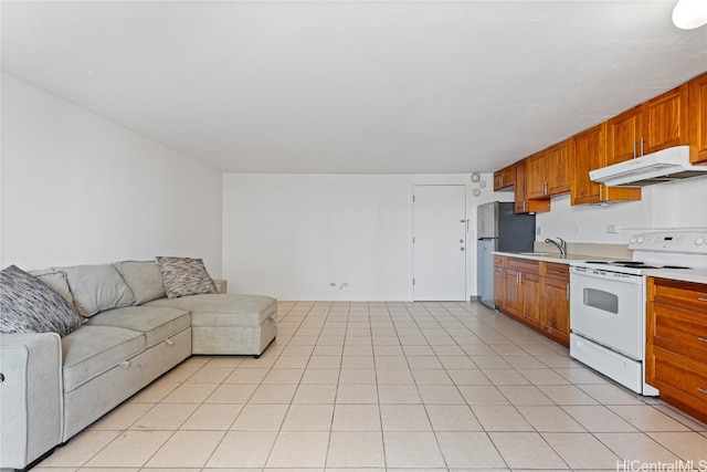 kitchen with light tile patterned flooring, stainless steel refrigerator, and white electric stove