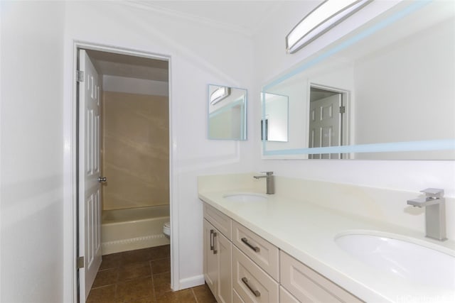 full bathroom with bathing tub / shower combination, toilet, vanity, crown molding, and tile patterned flooring