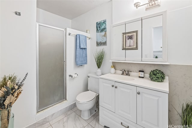 bathroom with vanity, toilet, and walk in shower