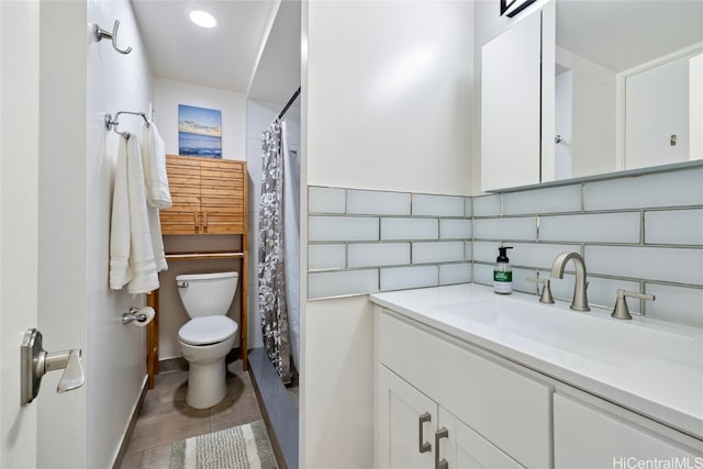 bathroom with vanity, toilet, and tile patterned floors