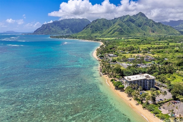 aerial view featuring a water and mountain view and a beach view