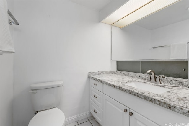 bathroom with vanity, toilet, and tile patterned flooring