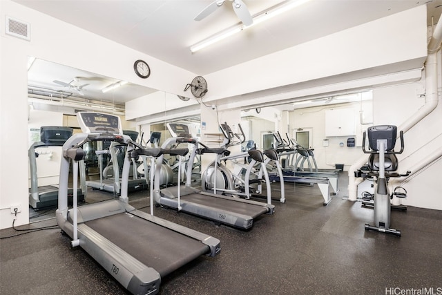 exercise room with ceiling fan