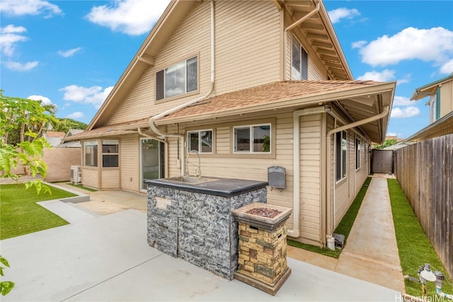 back of house with a patio area