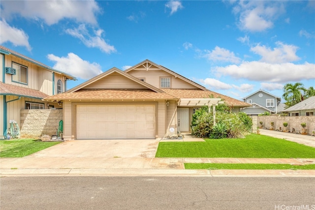 view of front facade with a front yard and a garage