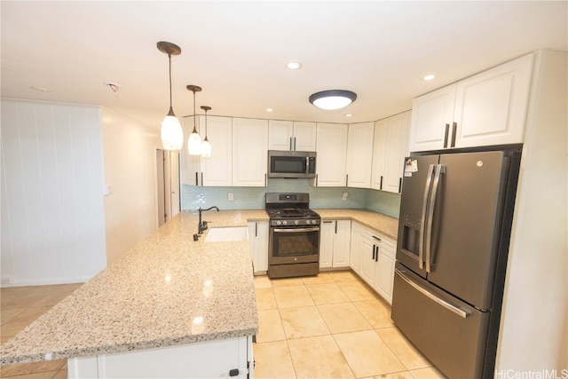 kitchen with white cabinets, sink, and appliances with stainless steel finishes