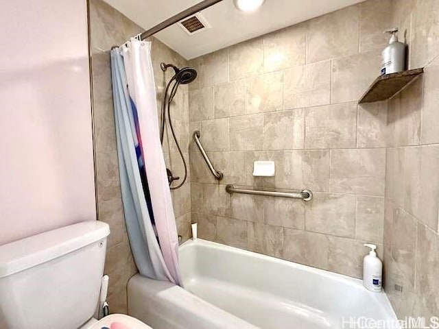 bathroom with toilet and shower / bath combination with curtain