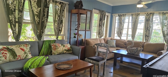 sunroom featuring ceiling fan and plenty of natural light