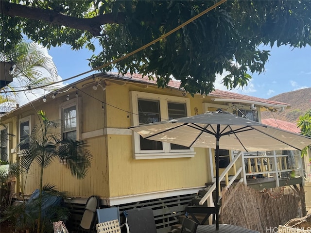 rear view of house featuring a deck