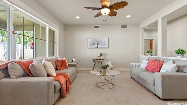 carpeted living room with ceiling fan