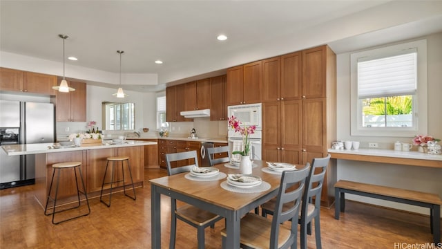 dining area with wood-type flooring