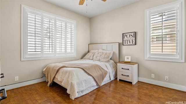 bedroom featuring hardwood / wood-style flooring and ceiling fan