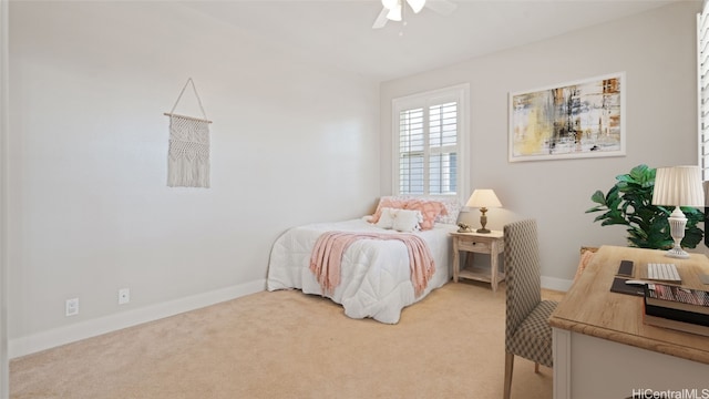 bedroom featuring light colored carpet and ceiling fan