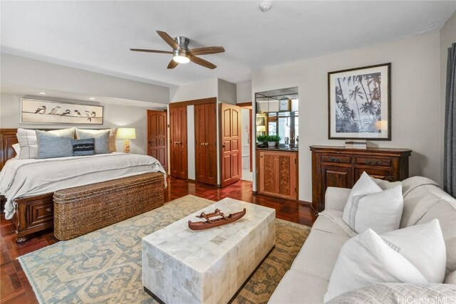 bedroom featuring ceiling fan and dark hardwood / wood-style floors