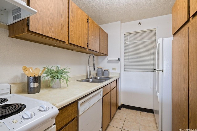 98-501 Koauka Loop Unit A603, Aiea, HI 96701 - kitchen with white appliances, a sink, light countertops, extractor fan, and light tile patterned floors