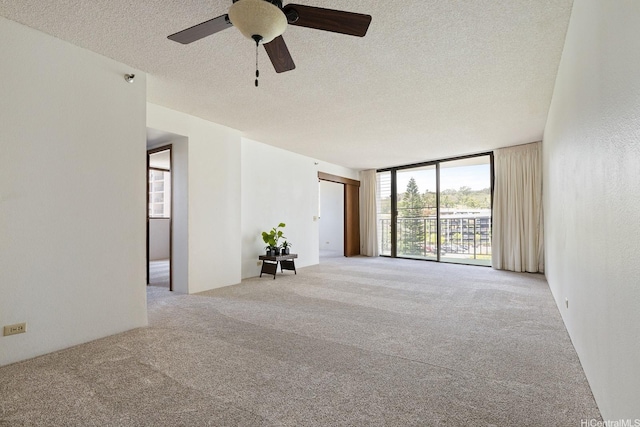 98-501 Koauka Loop Unit A603, Aiea, HI 96701 - carpeted spare room featuring expansive windows, a textured ceiling, and ceiling fan