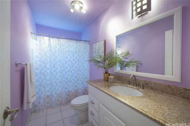 bathroom featuring a shower with curtain, tile patterned flooring, vanity, and toilet