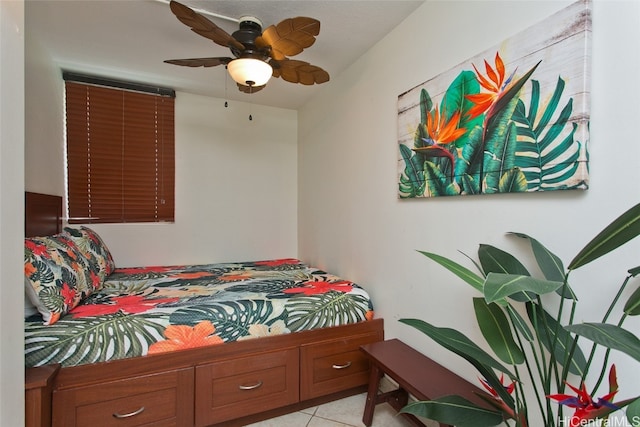 bedroom featuring light tile patterned flooring and ceiling fan