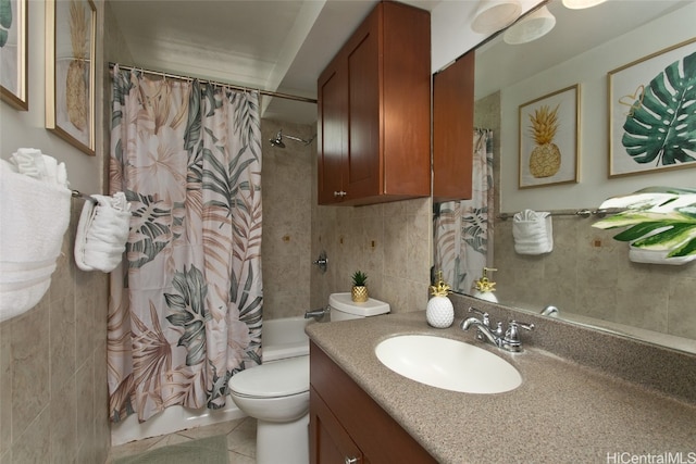 full bathroom with tile walls, shower / bathtub combination with curtain, toilet, vanity, and tile patterned flooring