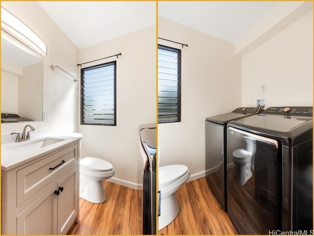 bathroom with separate washer and dryer, vanity, wood-type flooring, and toilet