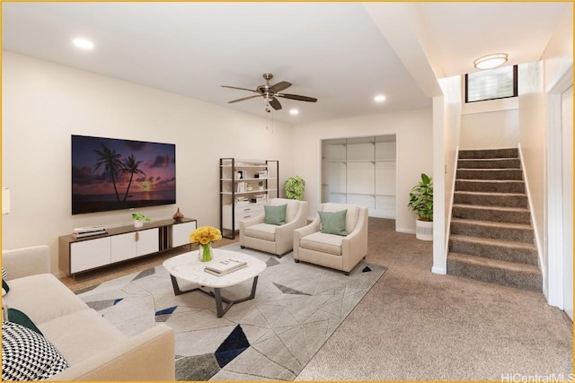 carpeted living room featuring ceiling fan