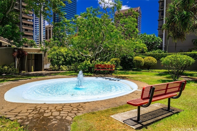 view of pool featuring a yard